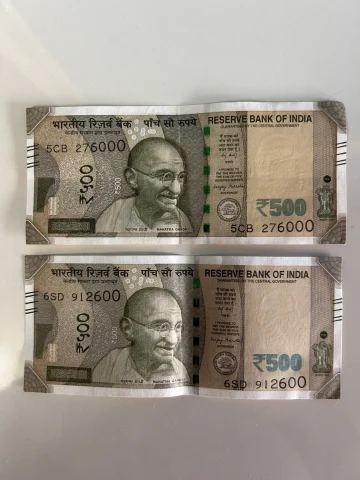 Two 500 Rupees notes with special numbers