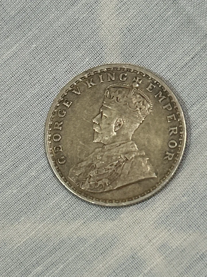 This is a 1916 British India 1 Rupee, King George V. It is a silver coin (91.67% silver). — photo 1 of 2