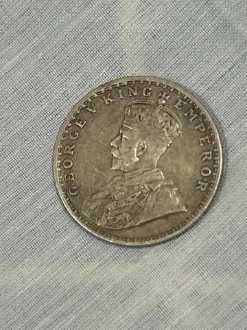 This is a 1916 British India 1 Rupee, King George V. It is a silver coin (91.67% silver).