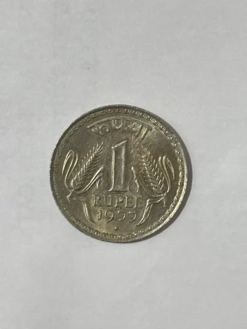 Indian 1 Rupee coin featuring the iconic two ears of corn design.