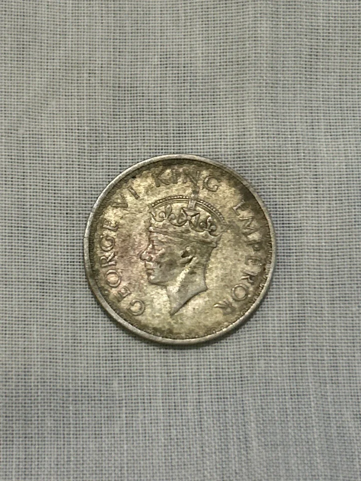 British India 1942 Half Rupee (8 Annas), King George VI, and it is a silver coin. The standard 1942 Bombay… — photo 1 of 2